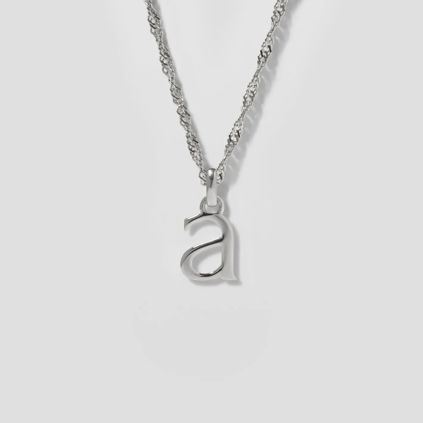 Store STILNEST Initial mit Singapore Kette