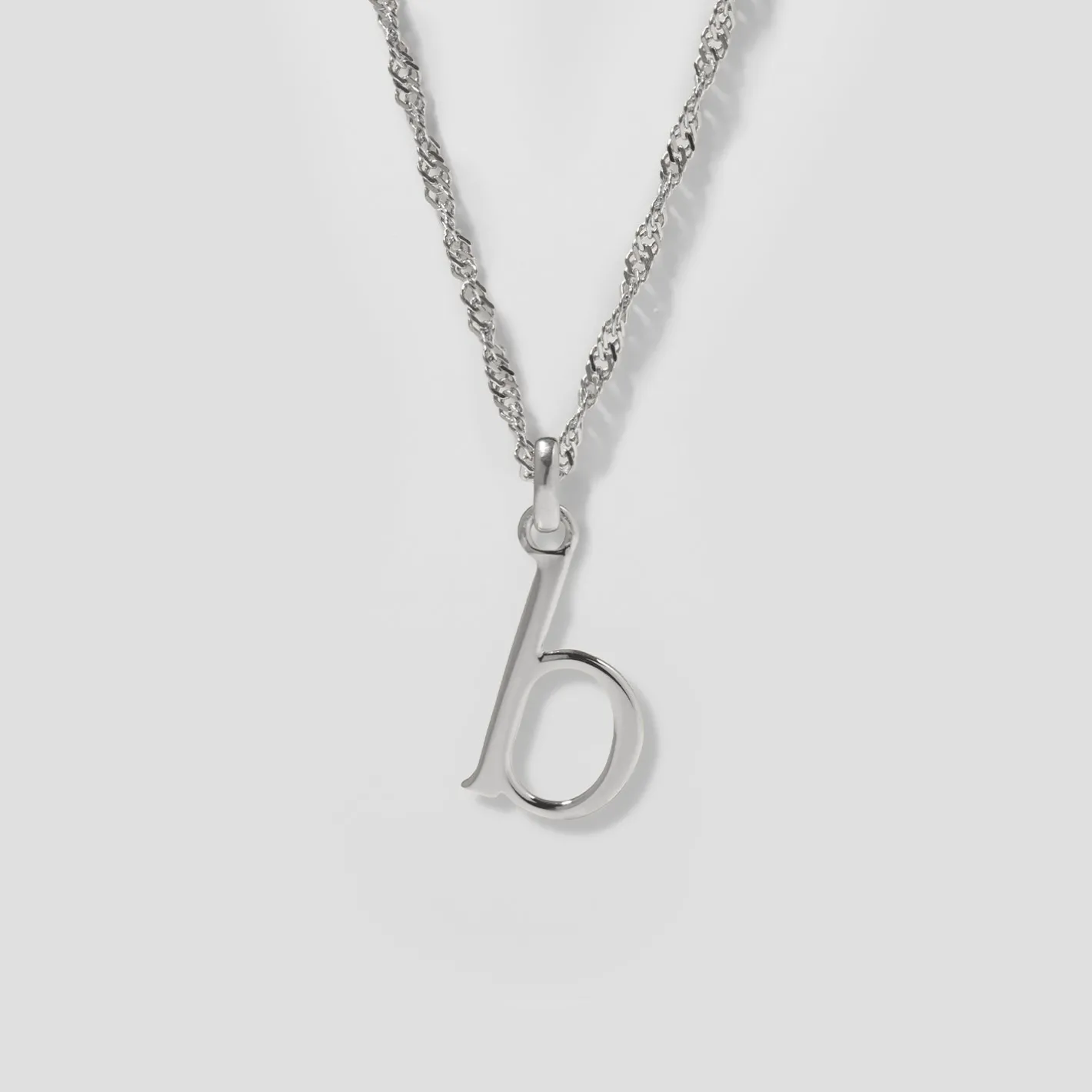Store STILNEST Initial mit Singapore Kette
