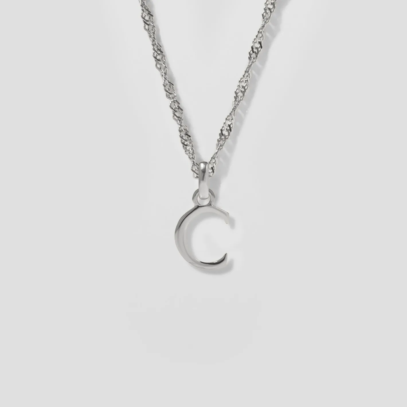 Store STILNEST Initial mit Singapore Kette