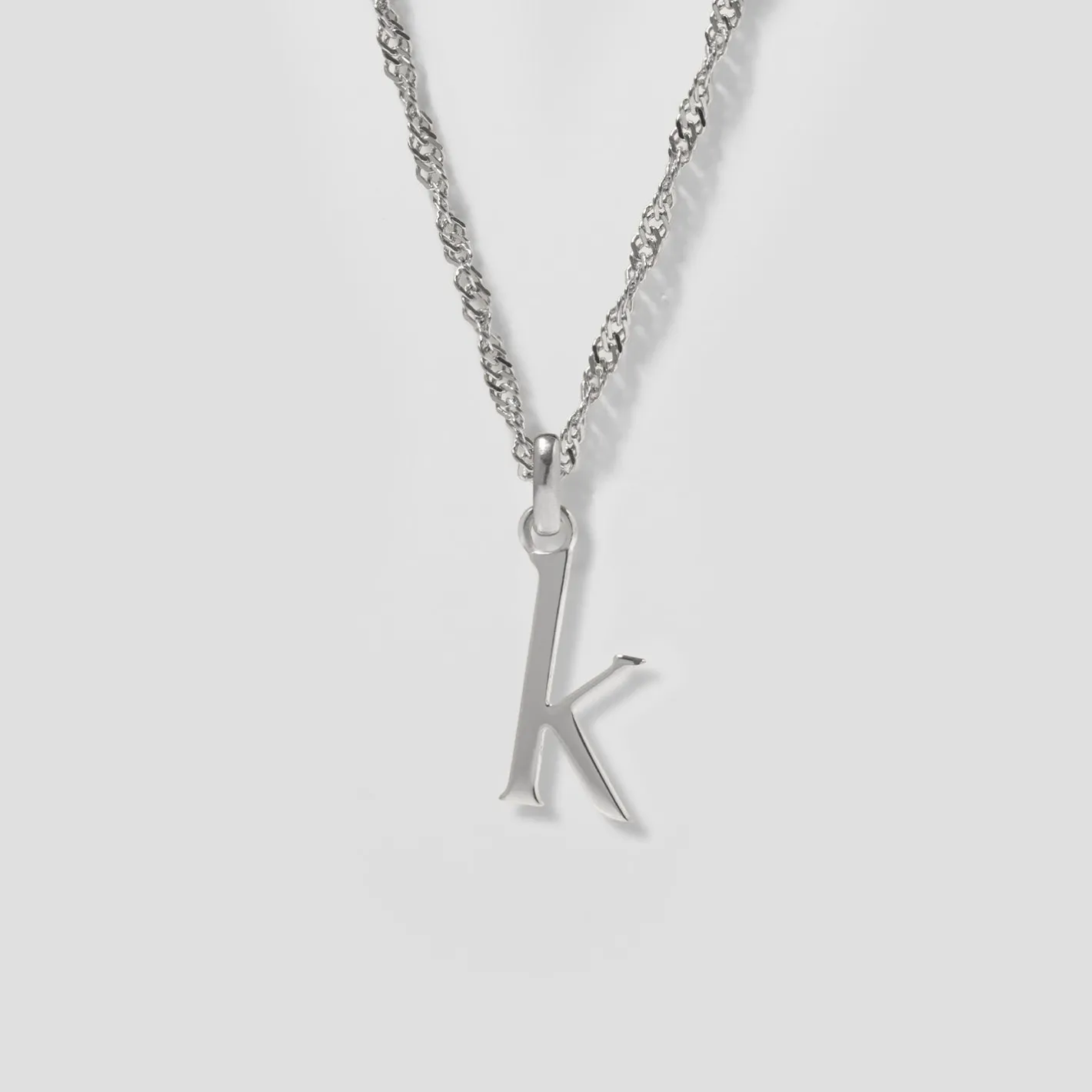 Store STILNEST Initial mit Singapore Kette