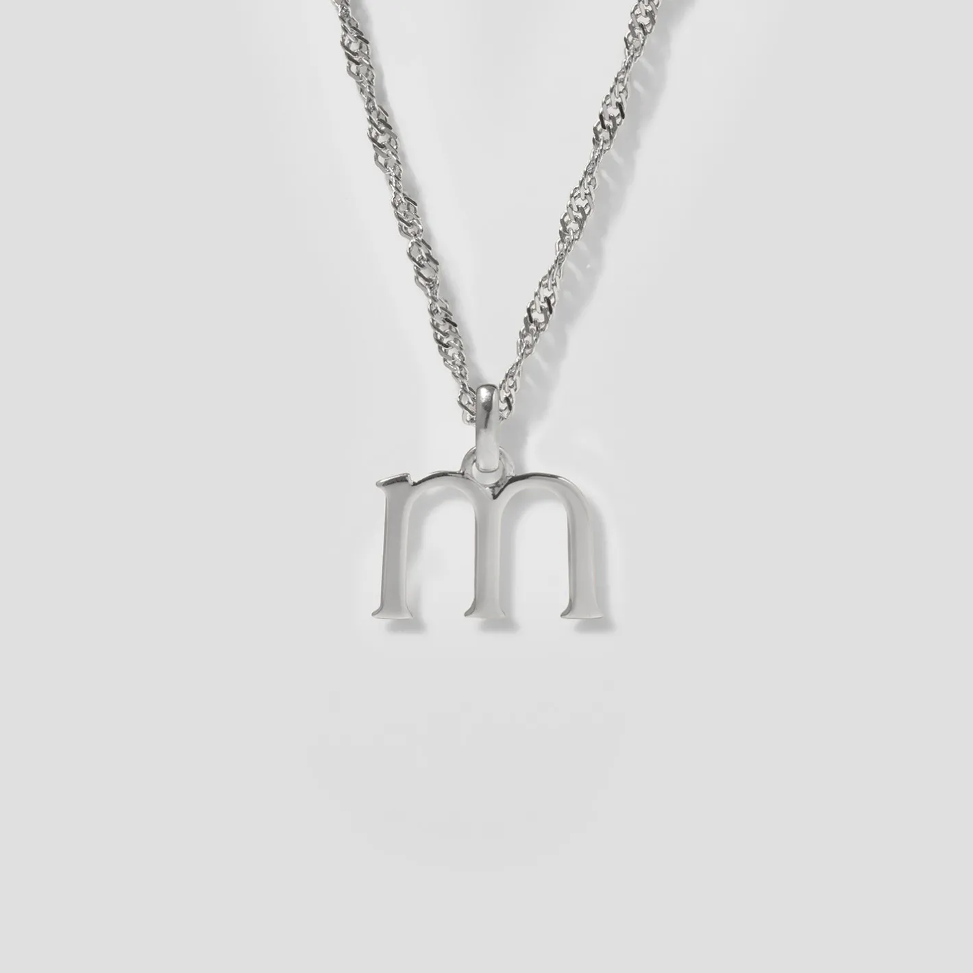 Store STILNEST Initial mit Singapore Kette