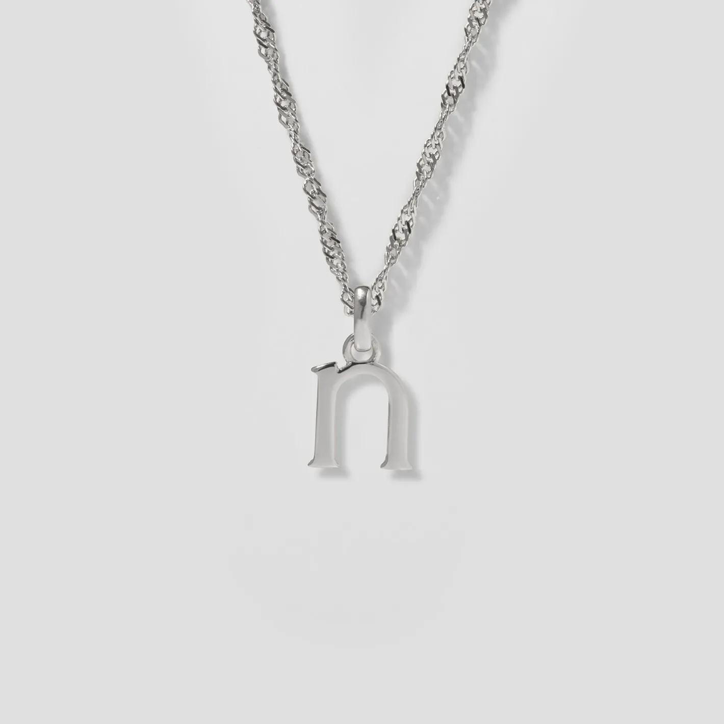 Store STILNEST Initial mit Singapore Kette