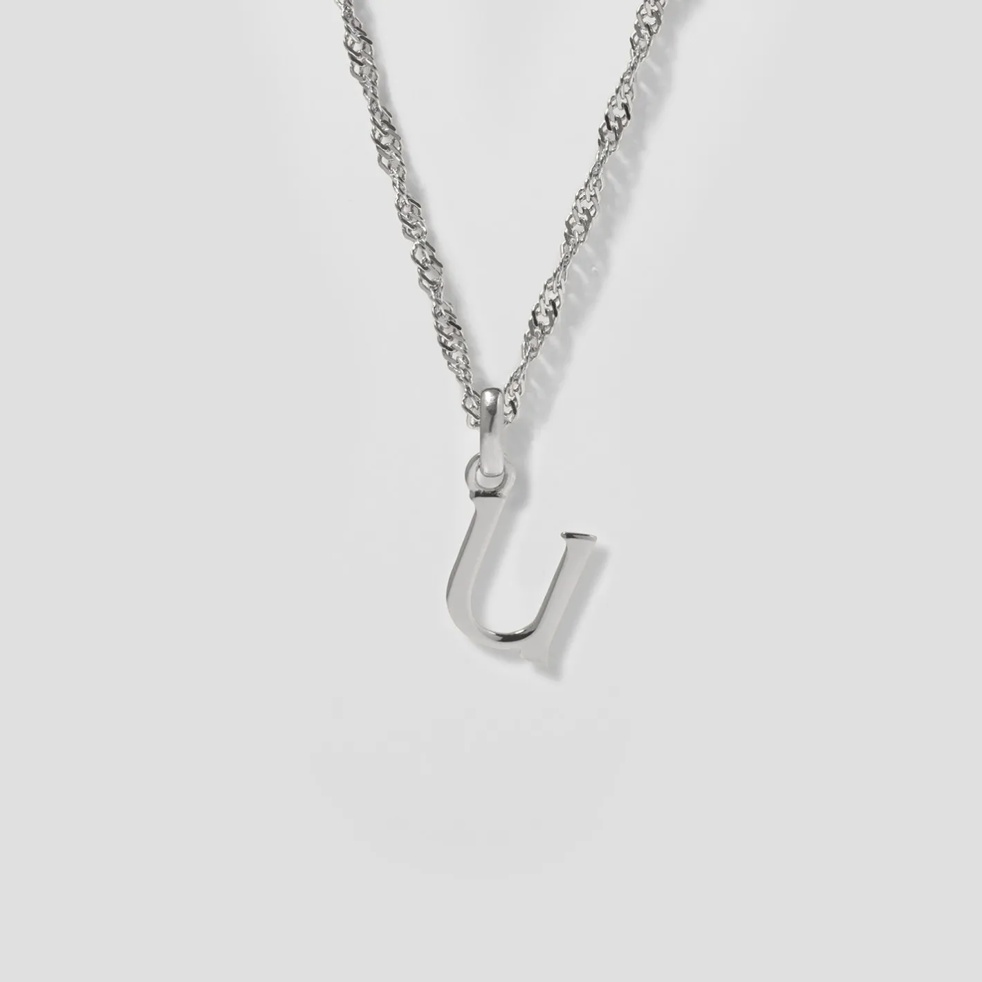 Store STILNEST Initial mit Singapore Kette
